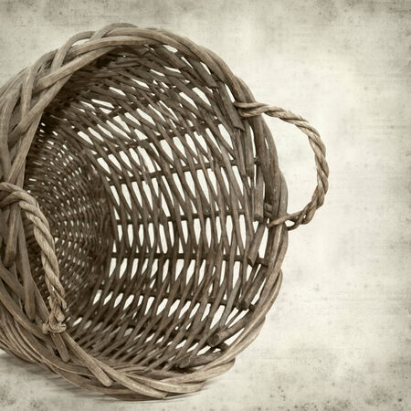 textured old paper background with large harvest basketの写真素材
