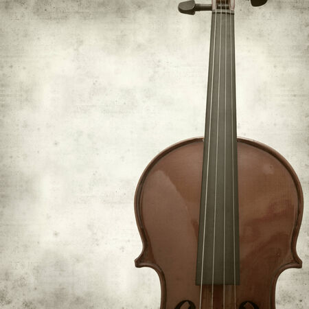 textured old paper background with violin