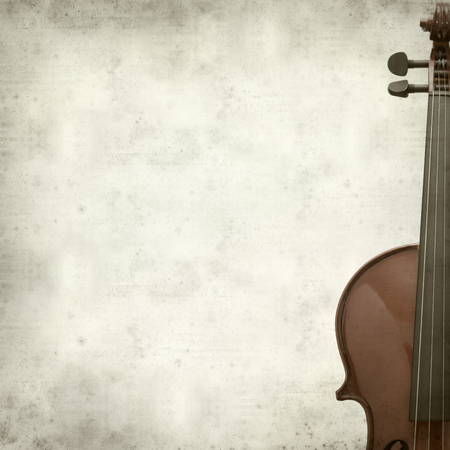 textured old paper background with violinの写真素材