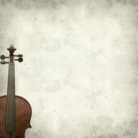 textured old paper background with violinの写真素材