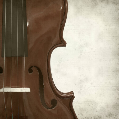 textured old paper background with violinの写真素材