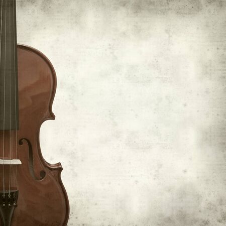 textured old paper background with violinの写真素材