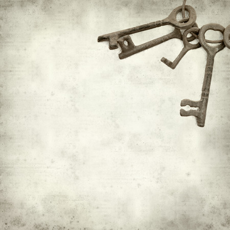 textured old paper background with old keysの写真素材