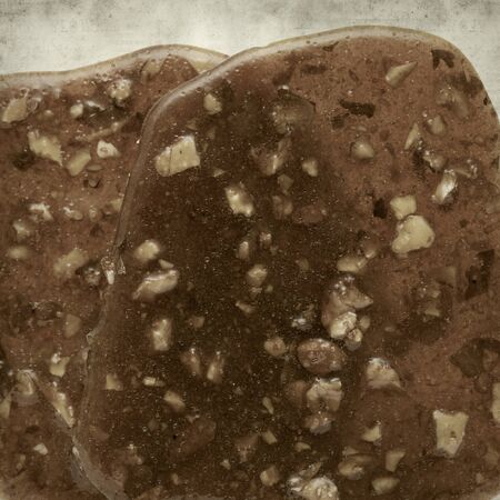 textured old paper background with almond brittle sweetの写真素材