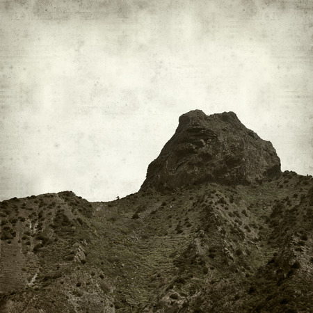 textured old paper background with La Gomera landscapeの写真素材