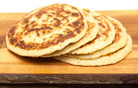 a few pancakes on a wooden surfaceの写真素材