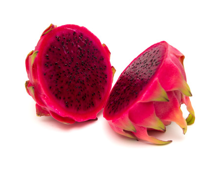 cut red dragon fruit with green scales isolated on whiteの写真素材