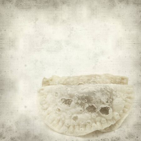 textured old paper background with traditional canarian sweet truchas de fruta