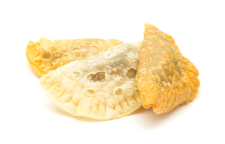 Canary islands sweets - truchas de fruta. Trucha is literally a trout, which refers to fish-like shape of the pastry, traditionally filled with sweet potato, but with possible variations, here filled with summer fruitの写真素材