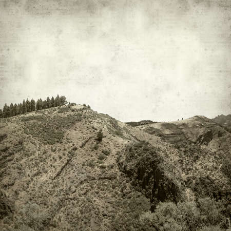 textured old paper background with landscape of Gran Canariaの写真素材