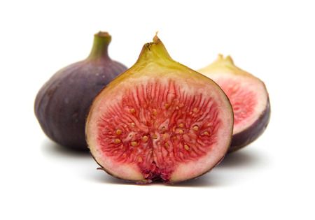 ripe purple figs isolated on white backgroundの写真素材