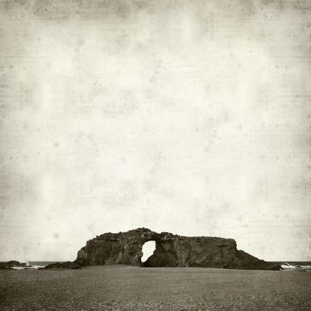 textured old paper background with Fuerteventura, Canary Islands, Arco del Juradoの写真素材
