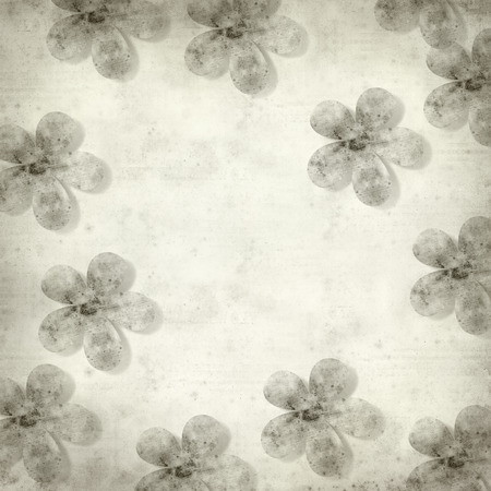 textured old paper background with stylized flower patternの写真素材