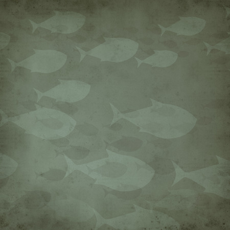 textured old paper background with many swimming fishの写真素材