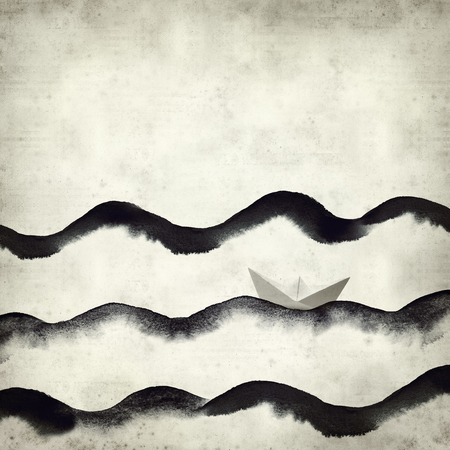 textured old paper background with watercolor waves and paper boatの写真素材