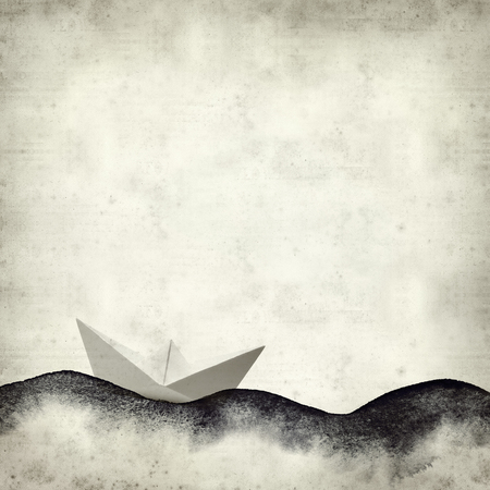 textured old paper background with watercolor waves and paper boatの写真素材