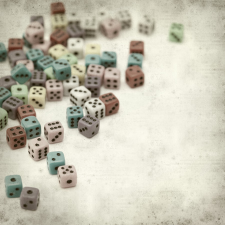 textured old paper background with many small diceの写真素材