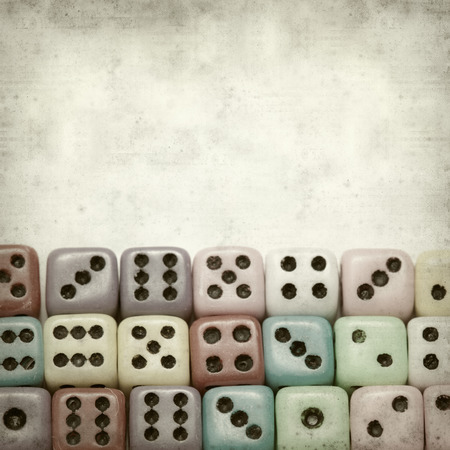 textured old paper background with many small dice