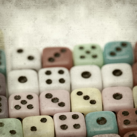 textured old paper background with many small dice