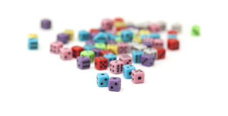 many small colorful plastic  dice isolated on white backgroundの写真素材