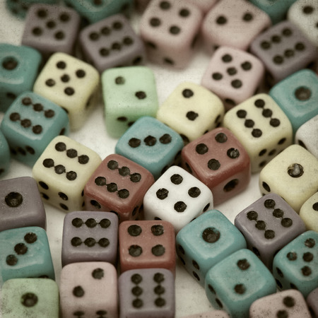 textured old paper background with many small diceの写真素材