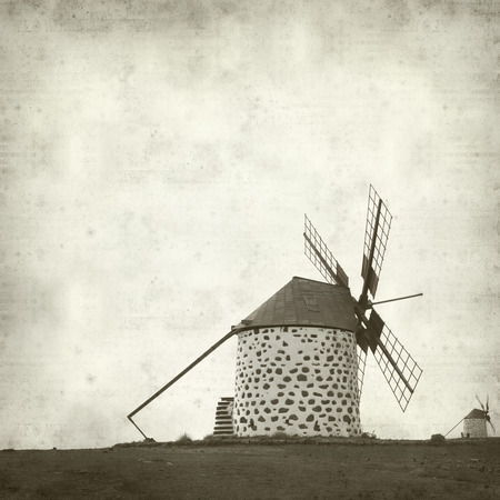 textured old paper background with windmills of Fuerteventuraの写真素材