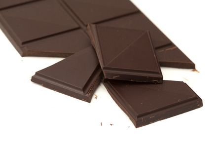 dark chocolate bar isolated on white backgroundの写真素材