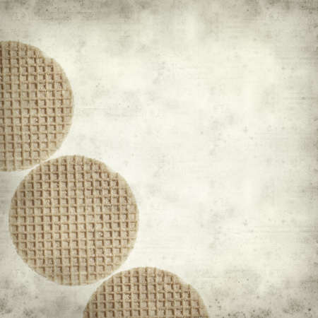 textured old paper background with dutch syrup waffleの写真素材