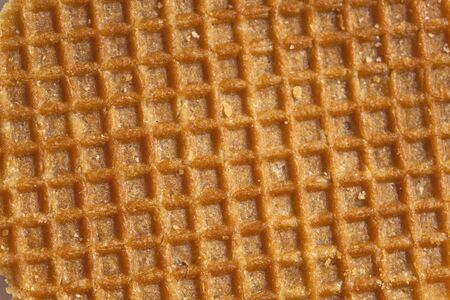 dutch caramel waffle surface sweet food backgroundの写真素材