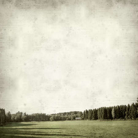 textured old paper background with landscape of Finlandの写真素材