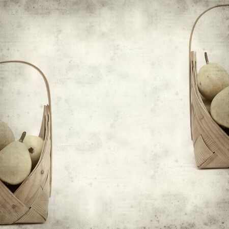 textured old paper background with birch bark basket full of yellow pearsの写真素材