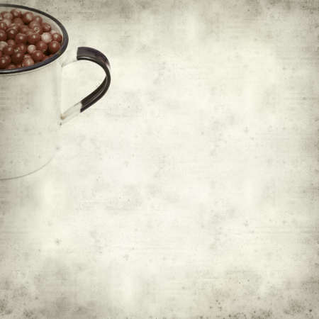 textured old paper background with freshly picked lingonberryの写真素材