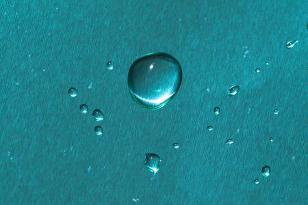 blue brushed metal surface with water drops weather backgroundの写真素材