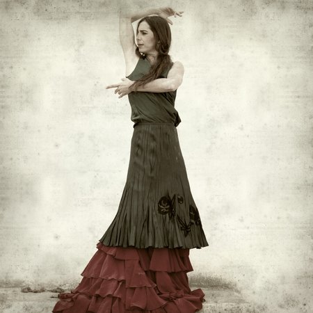textured old paper background with flamenco dancer in ruins of old churchの写真素材