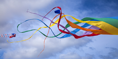 FUERTEVENTURA, SPAIN - NOVEMBER 11: Viewers watch from the ground as colorful kites fill the sky at 29th International Kite Festival, November 11, 2016 in Dunes of Corralejo, Fuerteventura, Spainのeditorial素材