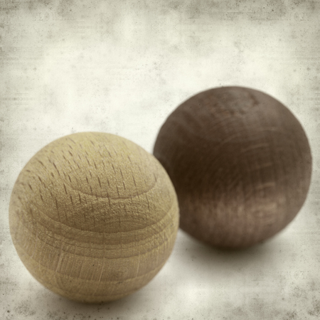 textured old paper background with wooden balls air freshenersの写真素材