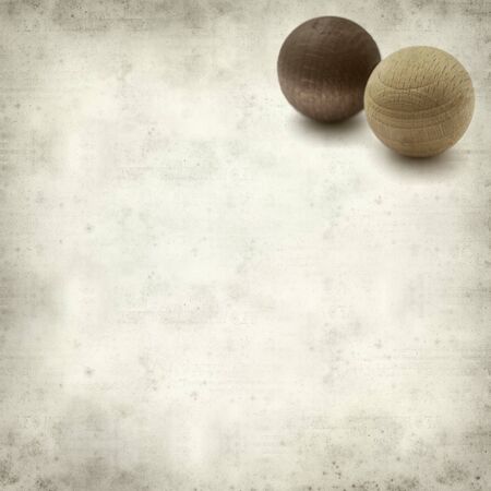 textured old paper background with wooden balls air freshenersの写真素材