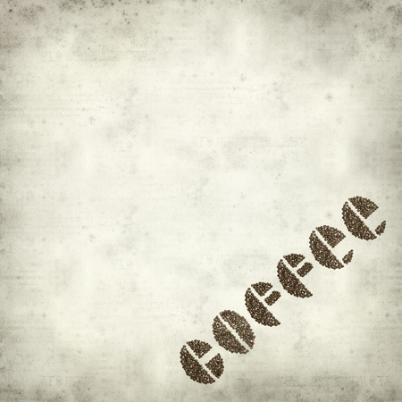textured old paper background with letters made of coffee grainsの写真素材