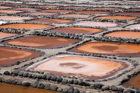 Gran Canaria, Salt evaporation ponds Salinas de Tenefe, south east of the island, pink color created by  algae Dunaliella salinaの写真素材