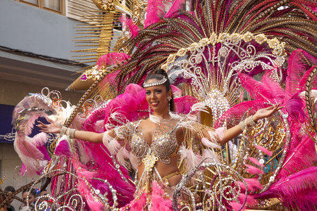 Las Palmas de Gran Canaria, Spain - March 04: Carnival Dame greets the public at Main Carnival Parade, March 4, 2017  in Las Palmas de Gran Canaria, Spainの写真素材