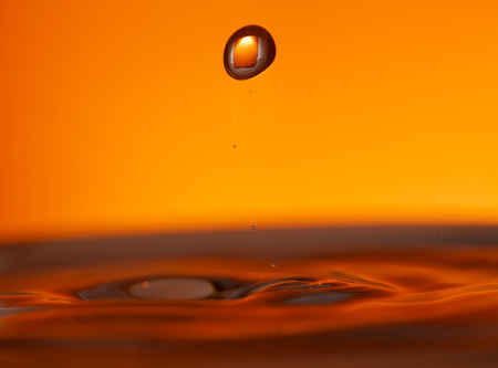 drop of ink falling into liqiud, abstract background