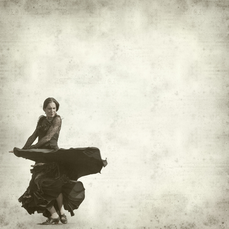 textured old paper background with flamenco dancer の写真素材