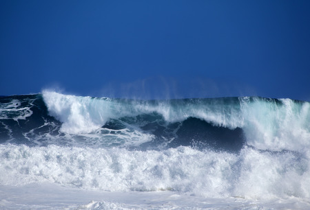 Gran Canaria, foamy waves breaking by the shore in Banaderos areaの写真素材