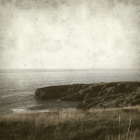 textured old paper background with landscape of Cantabria, Northern Spainの写真素材
