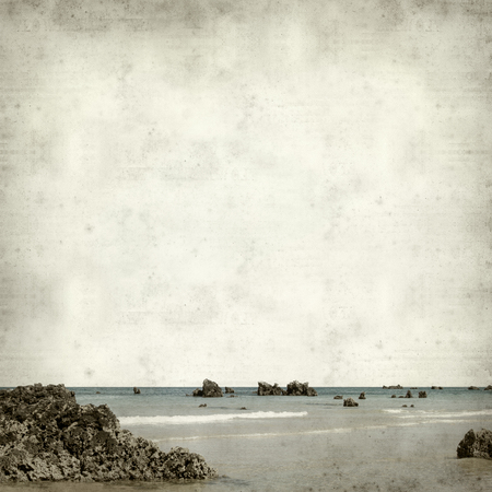 textured old paper background with coastal landscape of Cantabriaの写真素材