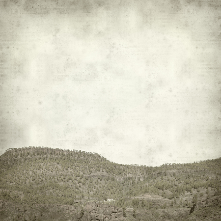 textured old paper background with Gran Canaria landscape の写真素材
