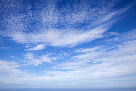 cloudscape over ocean  natural  background of predominantly skyの写真素材