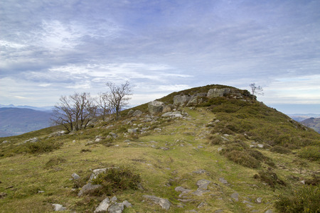 Cantabria, view from hiking path to  Monte Cilda over rolling hills, afternoon light