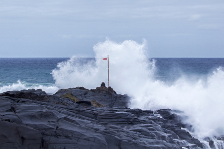 natural background of foamy ocean waves breaking by the shores of Gran Canariaの写真素材