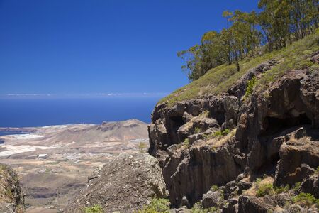Gran Canaria, June, view from the tops of Tamadaba massif over valley de Agaete towards Atlanticの写真素材